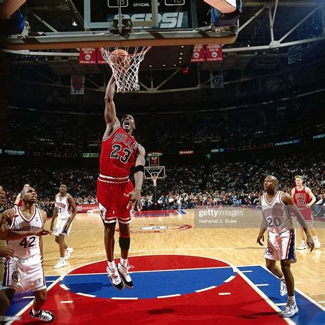 Michael Jordan of the Chicago Bulls dunks the ball against the... News ...