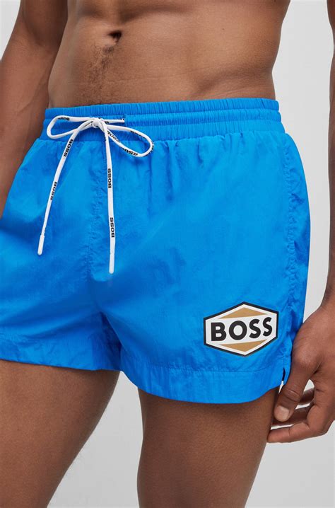 BOSS - Quick-drying swim shorts with logo details