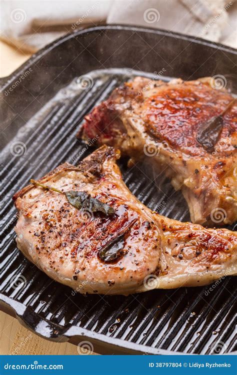 Steaming Pork Chops on Grill Frying Pan Stock Photo - Image of ...