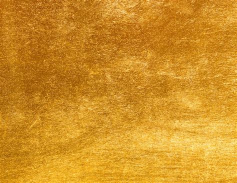 Shiny yellow leaf gold foil texture | Premium Photo
