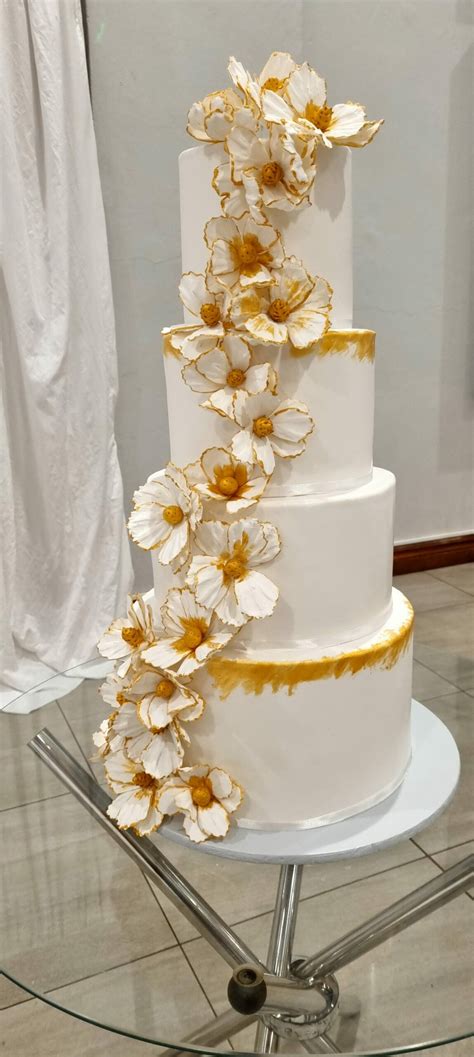 Gold and White Flower Cascade Wedding Cake 4 Tier | Baked by Nataleen