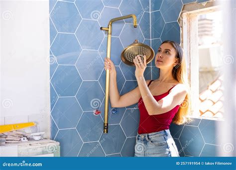 Beautiful Woman Chooses Place To Install New Shower during Renovation Work in Bathroom Stock ...