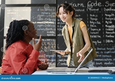 Student Talking To Teacher in the Classroom Stock Photo - Image of ...