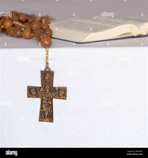Christian monk wooden cross necklace and open Holy Bible, symbols of ...