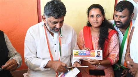 Congress's DK Shivakumar distributes guarantee cards to women voters in ...