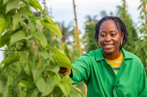 Premium Photo | Female african farmer working on a farm