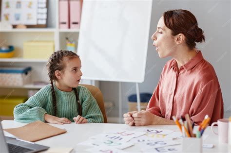 Premium Photo | English teacher teaching to pronunciate and reading the ...