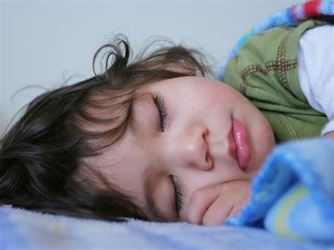 When can babies sleep with blankets? | BabyCenter