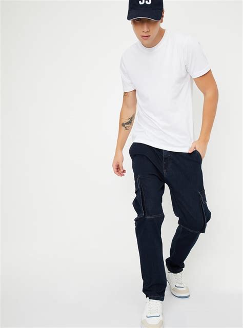 Buy Men Carrot Fit Washed Cargo Jeans Online at just Rs. 1499.0 ...