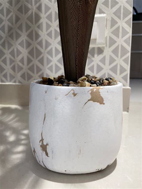 WHITE CERAMIC CORNER PLANT POT WITH ARTIFICIAL LEAVES – SUREKH DECOR