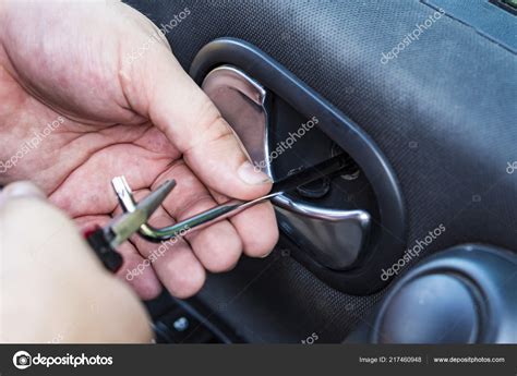 Car door handle repair. Allen key in mechanics hand. — Stock Photo ...