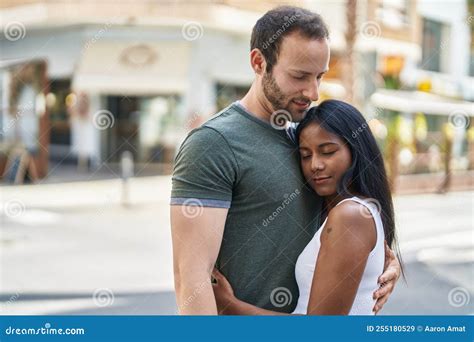 Man and Woman Interracial Couple Hugging Each Other at Street Stock ...