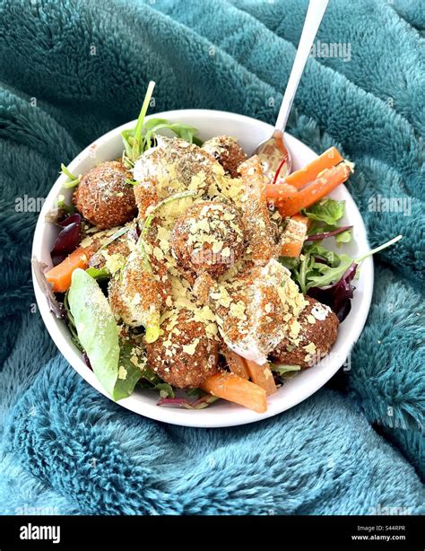Bowl of Moroccan falafels with salad and yeast flakes. Vegan food ...