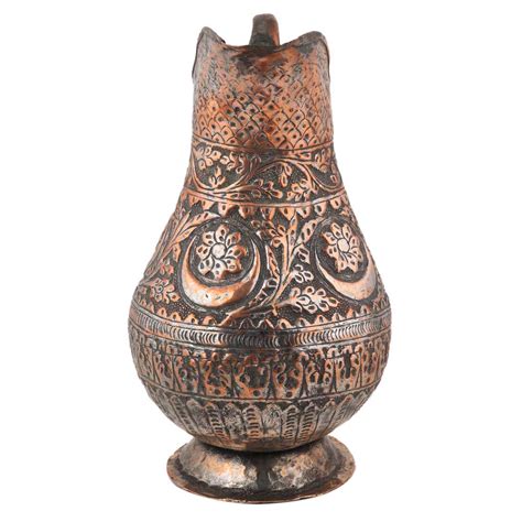 Copper Jug With Islamic Scrolling Motifs And Foliage