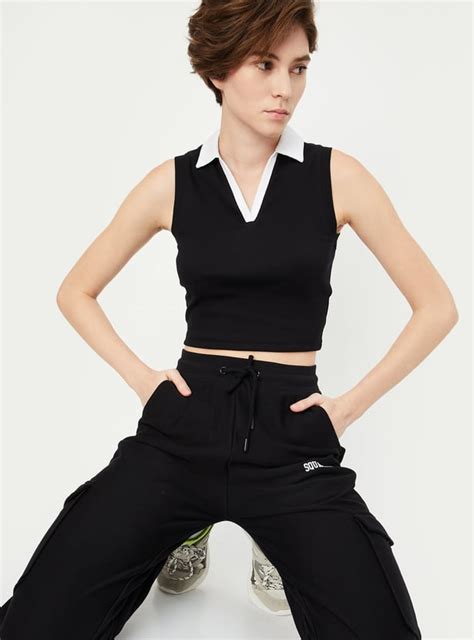 Buy Women Ribbed Johnny Collar Crop Top Online at just Rs. 399.0 ...