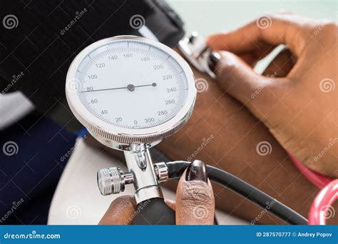 Doctor Measuring Patients Blood Pressure Stock Image - Image of high ...