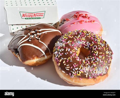 A selection of Krispy Kreme doughnuts with box logo Stock Photo - Alamy