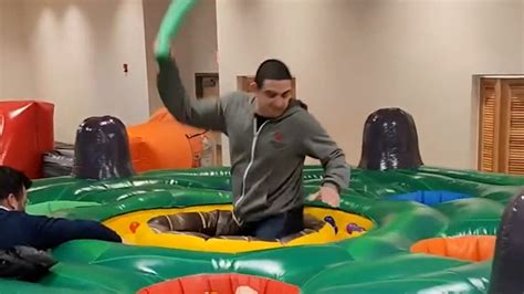 Co-workers let loose with whack-a-mole team building