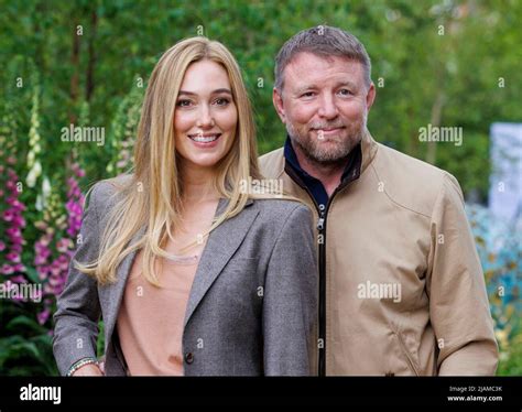 Film Director, Producer, screenwriter and businessman, Guy Ritchie with his wife, Jacqui Ainsley ...