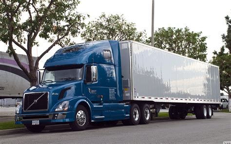 Blue Volvo VNL 670 with 53 ft trailer | Flatbed trailer, Tractor ...