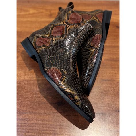 Buy Brown Snake Foil Boots in India