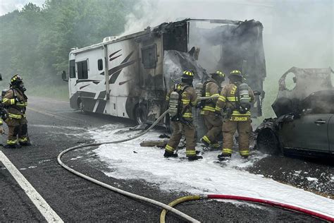 Photos: RV with car in-tow catches fire on I-24 East