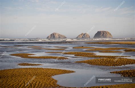 Three Arch Rocks Are Viewed From The Mouth Of Netarts Bay; Netarts ...