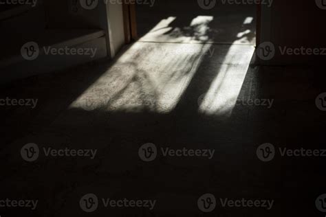 Light from window on floor. Shadow from window frame. Light in room ...