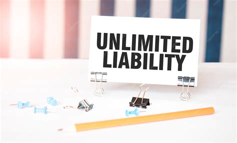 Premium Photo | Unlimited liability sign on paper on white desk with ...