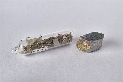 Manganese metal - argon sealed chips and a 99% pure chunk. : r ...