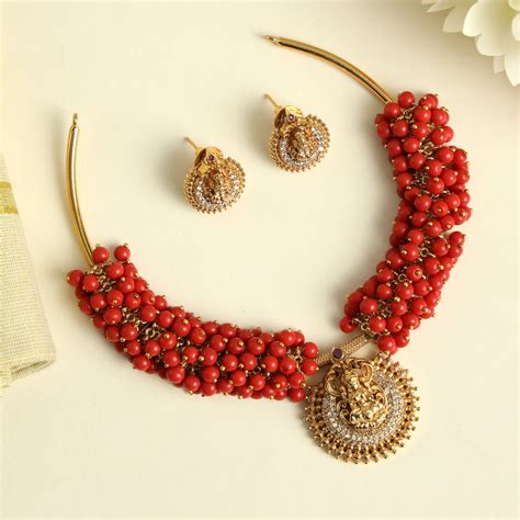 Antique Gold AD Lakshmi Pendant Hasli Set - Coral