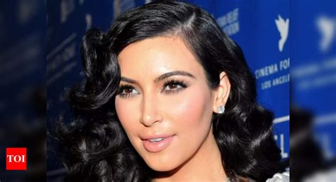 Kim Kardashian gets a piggyback ride from daughter North during beach ...