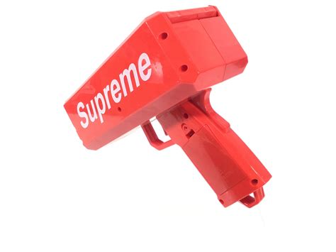 Lot - Supreme Money Gun With Fake Stacks Of Cash