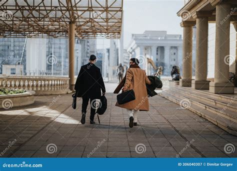 Two Business People Walking Side by Side 的图像结果