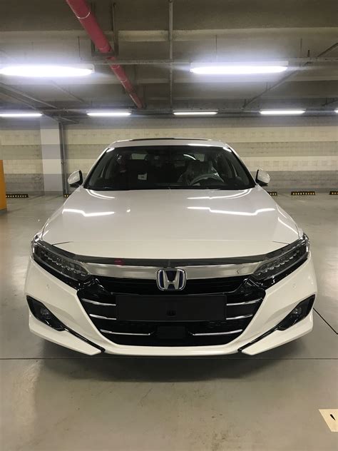White Honda Accord in a Parking Garage