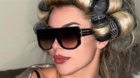 Glam footballer Madelene Wright puts on busty display in bra and open shirt as she plugs her ...