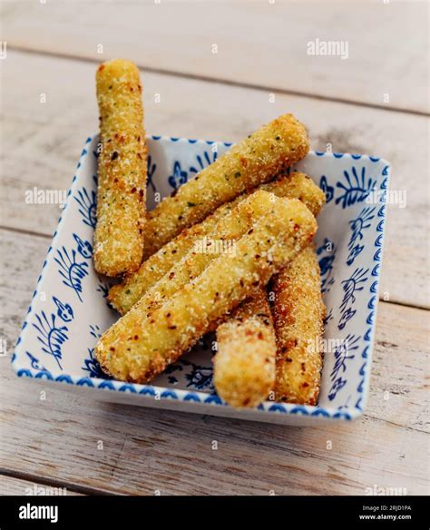 Battered and fried mozzarella sticks Stock Photo - Alamy