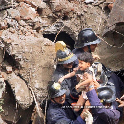 Indian Fire officials look for survivors from debris of a collapsed ...