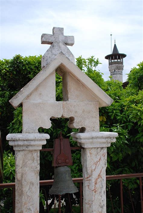 Bell hanging on structure against trees | Premium Photo
