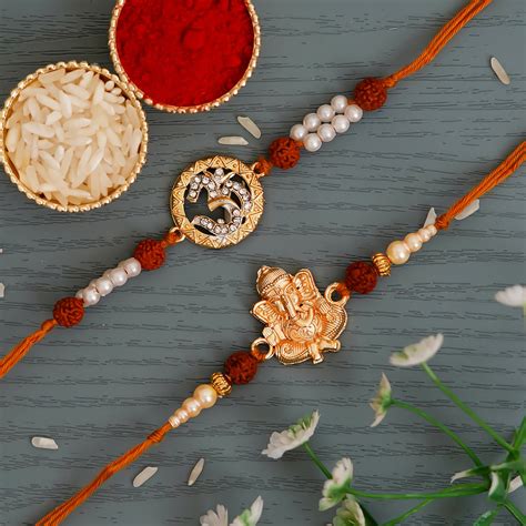 Om & Ganpati Pack of 2 Religious Rudraksh Rakhis and Roli Chawal Pack ...