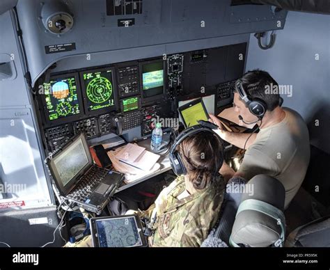 Alaska Air National Guardsmen Capt. Sara Warren, left, combat systems ...