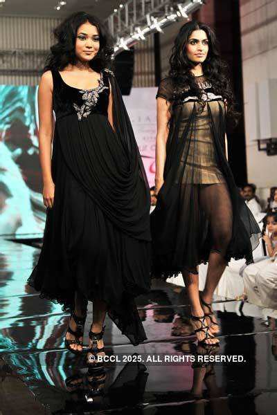 A model walks the ramp to showcase a creation by designer Swapnil ...