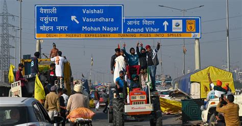 Farmer unions take out a victory march as year-long protests come to an end