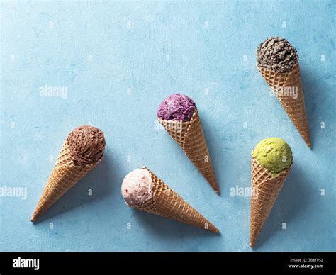 Various ice cream scoops in cones with copy space. Colorful ice cream ...