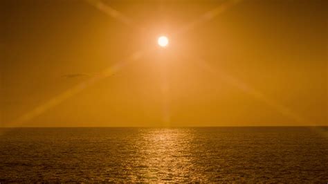 A timelapse of a sunset at sea over the horizon 22312595 Stock Video at ...
