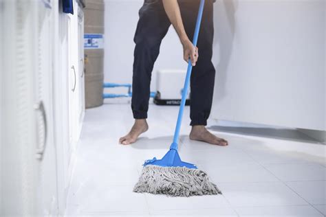 Person mopping the floor 1946370 Stock Photo at Vecteezy
