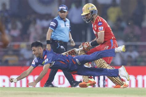 Sikandar Raza looks on with Ravi Bishnoi diving in front of him ...