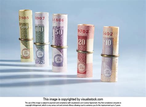 Variation of Indian Rupee banknotes roll with ring Money Concept