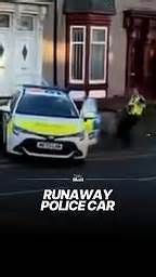 Officer chases unattended police car before it crashes into wall
