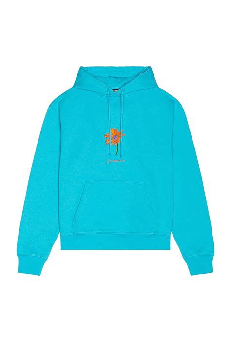 JACQUEMUS Le Sweatshirt Piston in Patch Marguerite in Turquoise | FWRD